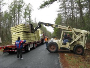 Unloading building materials for The New Alexandrian Library.