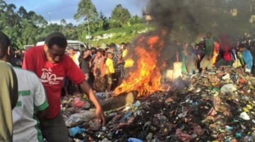 Kepari Leniata being burnt to death in Papua New Guinea for the crime of "sorcery."