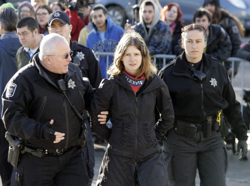 Alley Valkyrie being arrested last December. Photo: Kevin Clark/The Register-Guard