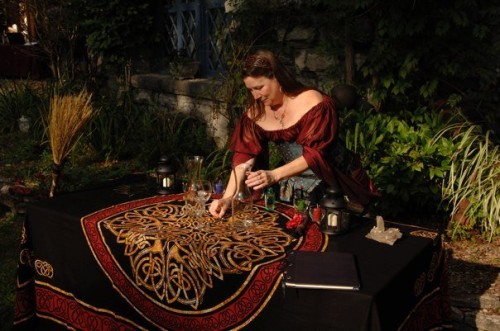 Mary Hudson preparing an altar