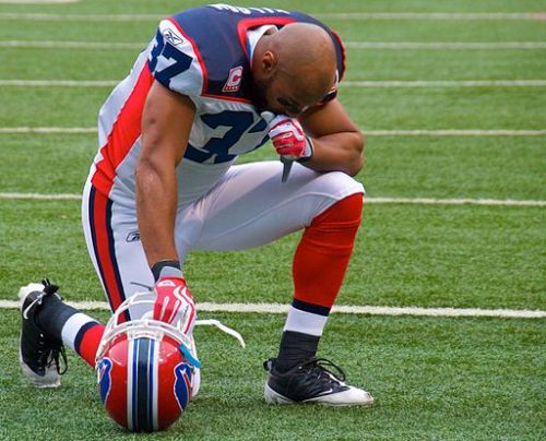 George Wilson in Prayer [Photo Credit: Ed Yourdon, Flickr via Wikimedia]