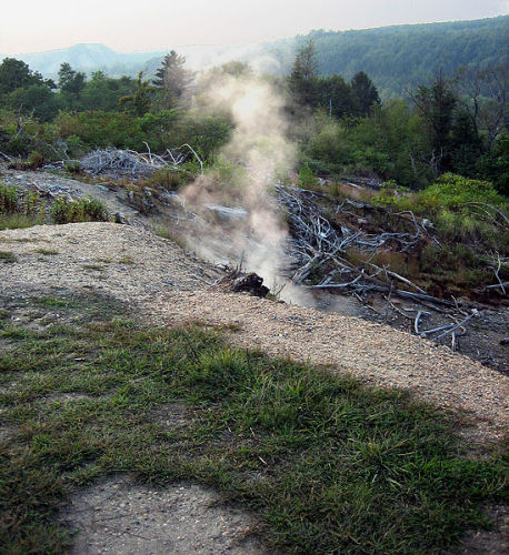 Smoke seeping out of the ground in Centralia, PA. Photo by jrmski