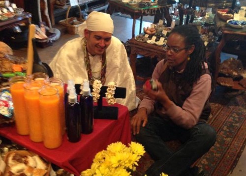 Florez and another celebrant making offerings and prayers [Courtesy Photo]