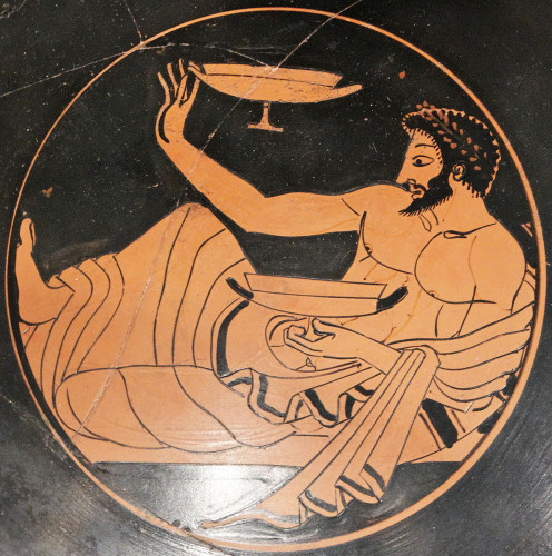 A man plays kottabos  on this kylix, Metropolitan Museum of Art. [Creative Commons, Marie-Lan Nguyen]