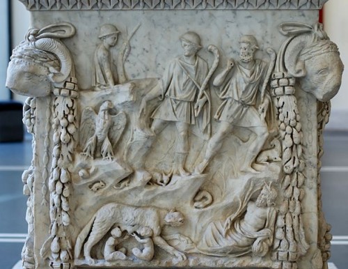 "Representation of Lupercal" From the portico of the Piazzale dei Corporazioni in Ostia, Antica. (98-117 CE). [Public Domain] 