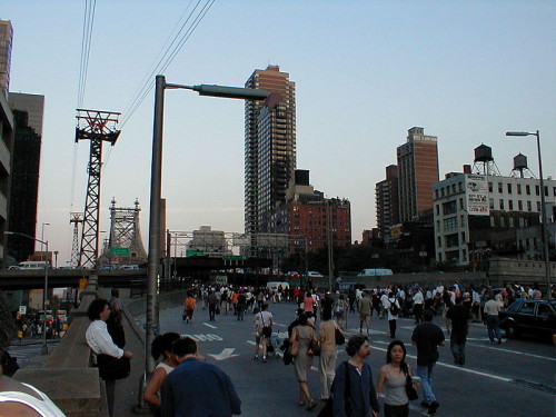 Crowds walking home in NYC during the 2003 blackout. Photo by Glitch010101. 