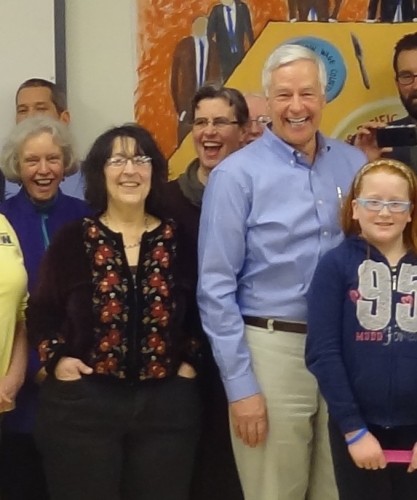 Rita Moran (left in black and red) pictured with Congressman Mike Michaud (blue shirt) and others.