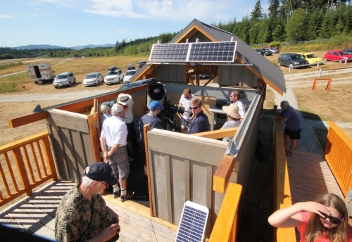 Visitors to the observatory get up close to the telescope. Photo courtesy of Kerr Cuhulain