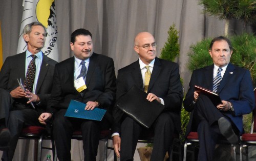 Four of the eight male presenters at the opening ceremony. [Photo Credit: Greg Harder]