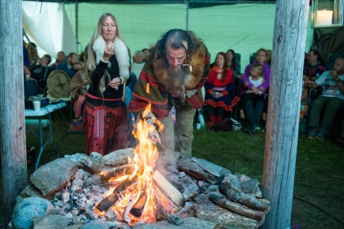 Tara LeAnn Eriksson and Tobias Kramp make an offering to the Holy Fire during the festival's closing ceremony.
