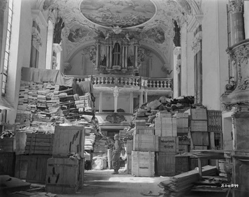 American GI looks at Nazi storage of confiscated material [Public Domain]