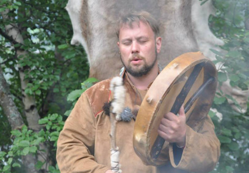 Kyrre Gram Franck drumming in Southern Norway in 2014 using a drum and hammer made and offered to him by the Hungarian shaman Regös Sziránszki József [Courtesy Photo]