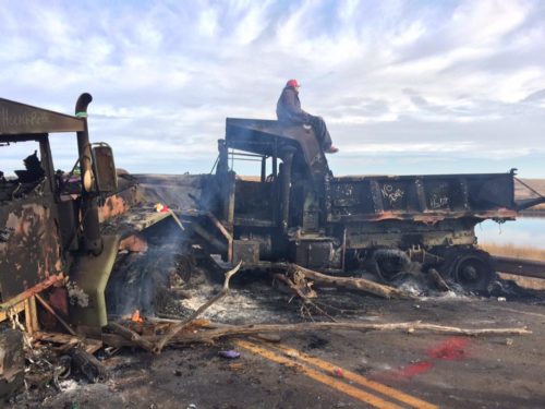 Burned National Guard vehicles, Highway 1806. [Ancestralpride.org]