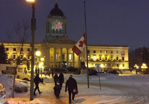 Canadian flag at half-mast for the fallen as people walk to vigil at Manitoba Legislature (photo by DG McKay)