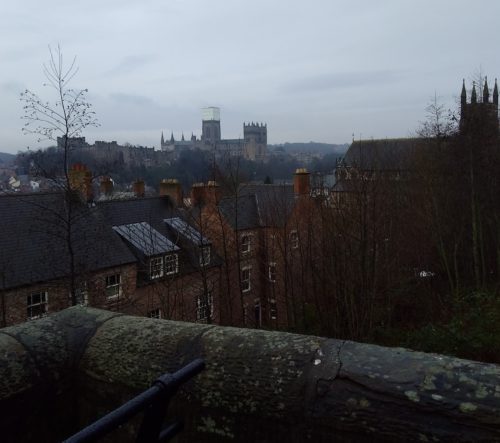 Overlooking Durham, England, with Durham Cathedral off in the mist. [Photo by E. Scott.]